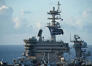 USS Theodore Roosevelt (CVN 71) flies a “Don’t Give Up the Ship” flag. (49966895161)