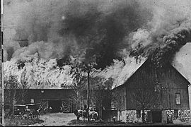 Large barn, with its roof ablaze