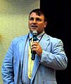 Joseph Pearce speaking into a microphone