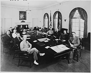 Photograph of President Truman with members of his Cabinet and other officials, in the Cabinet Room of the White... - NARA - 200610