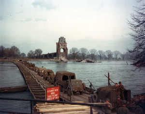 US Army mechanized forces cross the Rhine River on the Alexander Patch Heavy Pontoon Bridge