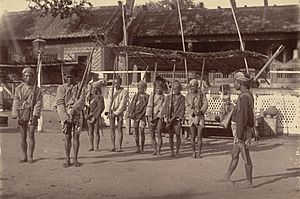 A Burmese police guard at Mandalay, by WW Hooper