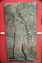 A human-headed and winged apkallu holding a pine cone and bucket for religious rituals. From the North-West of Ashurnasipal II at Nimrud, Iraq, 883-859 BCE. Alabaster-bas relief. Museum of the Ancient Orient, Istanbul, Turkey