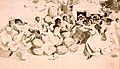 African Americans dancing around a pile of watermelons (cropped)