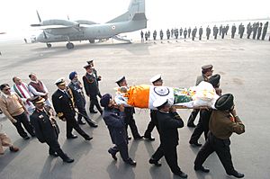 Army, Navy & Air Force personnels, the three wings of services, carrying the mortal remains of the former Prime Minister, Late Shri P V Narasimha Rao towards service aircraft at Palam Airport, New Delhi on December 24