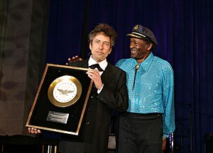 Chuck Berry presenting Golden Plate Award to Bob Dylan - 2003 Academy of Achievement Summit - DC.jpg