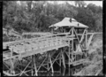 Dry land dredge at Lake Mahinapua, Hokitika. ATLIB 273079