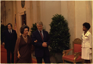 Jimmy Carter escorts Ladybird Johnson to the Panama Canal Treaty Dinner. - NARA - 176107