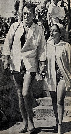 John Wayne with his third wife Pilar Pallete, 1954