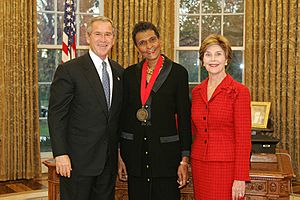 President George W. Bush and Mrs. Laura Bush with National Medal of Humanities Recipient Marva Collins in the Oval Office