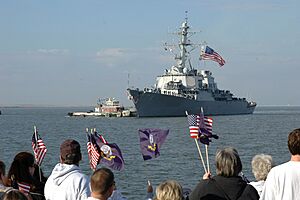 US Navy 061114-N-2248M-005 Families and friends wait on the pier as the guided-missile destroyer USS McFaul (DDG 74) arrives into port at Naval Station Norfolk after a six-month deployment