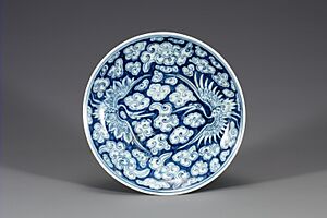 White Porcelain Dish with Cloud and Crane Design in Underglaze Cobalt Blue