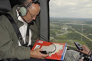 Wisconsin Governor Jim Doyle onboard a UH-60 Blackhawk viewing flood damage