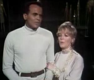 Petula Clark holding Harry Belafonte's arm (1968)