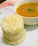 Carrot-potato soup served with rice