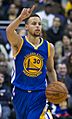 Stephen Curry dribbling 2016 (cropped)