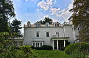 Southern portion of east elevation, part of the two-story white house