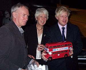 Boris Johnson -holding a red model bus -2007