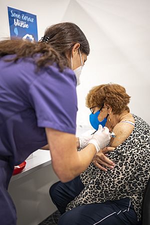 Elderly Slovak woman receiving her third Covid-19 vaccine 02