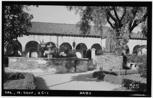 Historic American Buildings Survey Photographed by Henry F. Withey March 1936 FOUNTAIN AND STATUE IN MISSION PARK AND MISSION MONASTERY (SOUTH FRONT) - Mission San Fernando Rey HABS CAL,19-SANF,2C-1