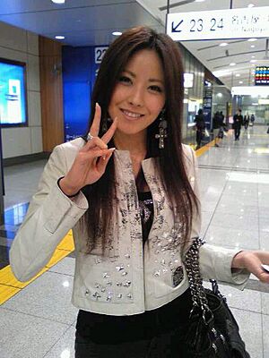 Melody, doing a peace sign