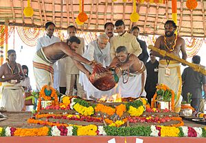 Narendra Modi performing the Pooja rituals at the foundation stone laying ceremony of 'Amaravathi'- the new capital of Andhra Pradesh. The Governor of Andhra Pradesh and Telangana, Shri E.S.L. Narasimhan