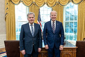 President Joe Biden stands next to President Sauli Niinistö in the Oval Office