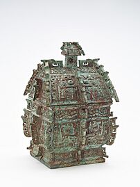 Ritual wine container (fangyi) with masks (taotie), serpents, and birds