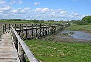 Aberlady Bay footbridge as it looks towards a nature reserve