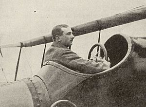 man sat in cockpit of old aeroplane