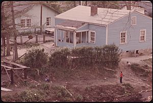 KIDS PLAYING OUTSIDE A HOME IN SHARPLES, WEST VIRGINIA, NORTH OF LOGAN. NOTE THE WAY THE OWNER HAS BUILT A PLACE TO... - NARA - 556439