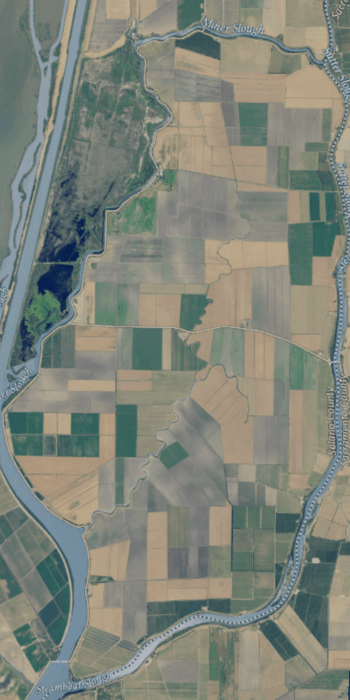 An aerial photograph of an island covered in farmland and surrounded by rivers.