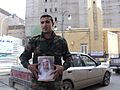 A Benghazi citizen holding King Idris's photo