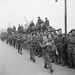 Churchill tanks of 6th Guards Tank Brigade and troops of the 10th Highland Light Infantry, 15th (Scottish) Division, during the assault on Tilburg, Holland, 28 October 1944. B11419