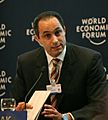 Man talking into a microphone at the World Economic Forum