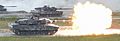 German Leopard 2A6 from 3rd Panzer Battalion fires it's main gun during the shoot-off of Strong Europe Tank Challenge (40964003420) (cropped)