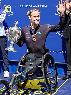 Marcel Hug receives trophy 129th-boston-marathon 54474853832 (1).jpg