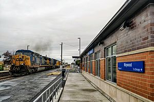 Maywood IL Commuter Station with CSX freight train