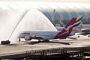 Qantas A380 receiving a water cannon salute at Dubai International Airport