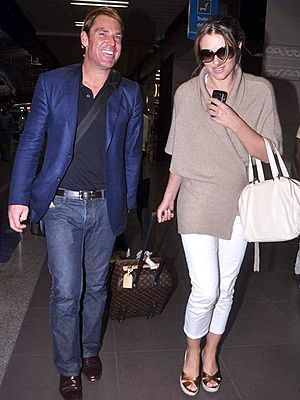 Shane Warne with, Liz Hurley snapped at the airport (5) (cropped)