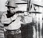Bill Tilghman (1854-1924) Holding A Winchester Rifle