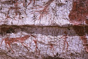 Detail of the mural showing the hind part of the aurochs, a deer and hunters.