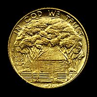 Gold dollar with a house shaded by trees