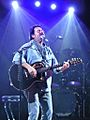 Steve Lukather with guitar, singing