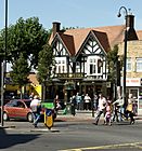 Hanwell Broadway showing the Coronation clock tower, with the Duke of York public house to the left of the image.