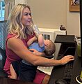 Karoline Leavitt feeding baby while working (cropped)