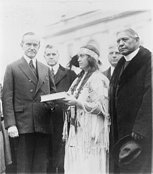 Miss Ruth Muskrat, a Cherokee Indian, presents Mr. Coolidge with a copy of The Red Man in the United States, a survey of the present day American Indian LCCN93506280 (cropped)