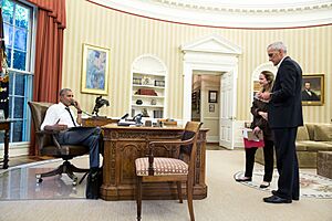 President Obama on the phone in the Oval Office with Secretary Kerry regarding the situation in Turkey (27716300004)