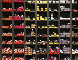 Shelve with various hair colours (hair dyes) in a hairdresser shop in Germany (2023)