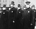 Spanish flu in 1918, Police officers in masks, Seattle Police Department detail, from- 165-WW-269B-25-police-l (cropped)